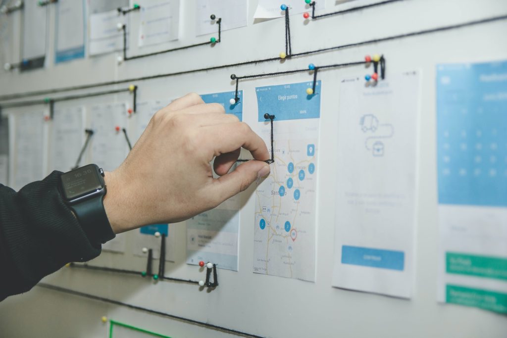 Why User-Centered Design is Crucial for Successful Products person working on blue and white paper on board